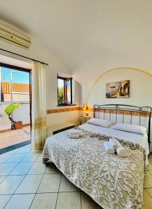 a bedroom with a large bed and a balcony at Il Rifugio Di Ela con 2 appartamenti in Furore +33 photos