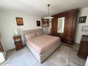 a bedroom with a bed and a table and a window at Raphael house in Gubbio