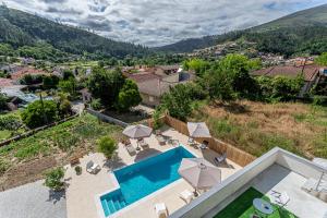 an aerial view of a villa with a swimming pool at Casa Manecas by Hostiva in Reriz