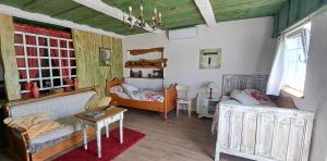 a room with two beds and a couch and a table at Šumski Dvori Apartment in Ogulin +38 photos
