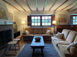 a living room with a couch and a fireplace at R2R - Finca Ranapega - 34A03 in Escamprero