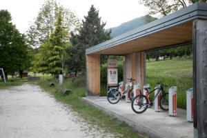 a group of bikes parked at a gas station at La Dimora del Cadore in Domegge di Cadore