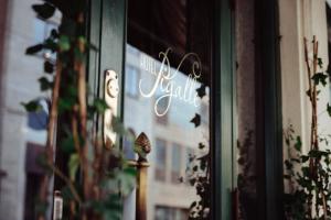 a sign in the window of a store at Hotel Pigalle in Gothenburg