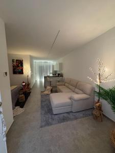 a living room with a white couch and a table at Occhi sul mare in Termoli