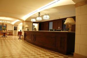 a lobby with a reception desk in a building at Relais La Fattoria in Melfi +55 photos