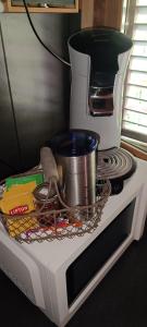 a coffee maker sitting on top of a microwave at Chalet de la Grave in LʼEscarène +14 photos