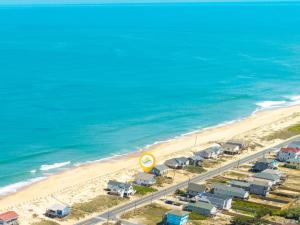 an aerial view of a beach with houses and a road at 4060 - Foxhole in Kitty Hawk Beach