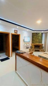 a living room with a desk and a television at Cozy Central Studio in Ifrane in Ifrane +1 photo