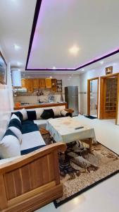 a living room with a couch and a table at Cozy Central Studio in Ifrane in Ifrane