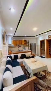 a living room with a couch and a table at Cozy Central Studio in Ifrane in Ifrane