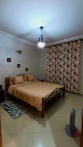 a bedroom with a large bed in a room at Cozy Central Studio in Ifrane in Ifrane