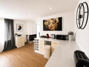 a kitchen with a white counter top in a room at Victoria Elegance Apartment in Sofia