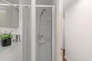 a shower with a glass door in a bathroom at Villa Aster in Coti-Chiavari +20 photos