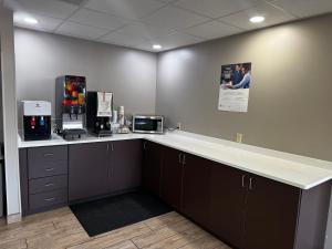 an office with a counter top with a coffee machine at Super 8 by Wyndham Conway in Conway
