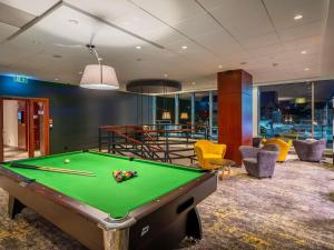 a billiard room with a pool table at Hotel Mercure Poznań Centrum in Poznań