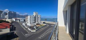 a view of a city from a balcony of a building at Hibernian Towers 307 in Strand +33 photos