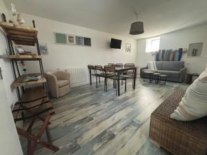 a living room with a table and chairs at Aux 4 Cornes - Chambres d'hôtes et Gite in Longeves