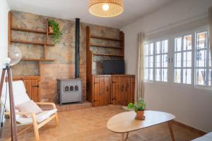 a living room with a couch and a table at La Huertina C2 in Zahora
