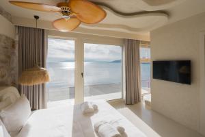 a bedroom with a bed with a view of the ocean at YU Townhouse in Bodrum City