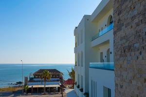 a view of a building with the ocean in the background at Diar Ayoub in Chebba