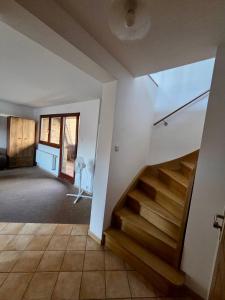 a room with a staircase in a house at Justinrent Szpitalna 4D-5 in Legnica