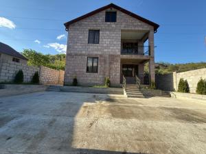 a large brick house with a large driveway at Dilisharm in Dilijan +6 photos