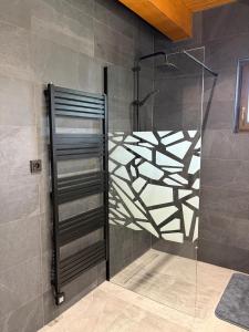 a shower with a glass door in a bathroom at Chalupa Nicol in Vítějeves +42 photos
