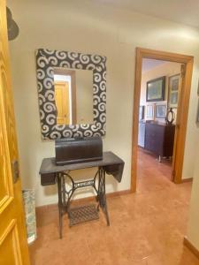 a room with a table with a mirror on the wall at Terra marina in Grao de Castellón +9 photos