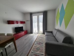 a living room with a couch and a table at Le Nogare in Abano Terme