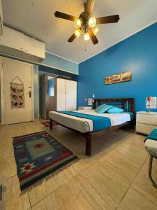 a bedroom with a bed and a ceiling fan at Florence Chalet in Marina Wadi Degla Ain Sokhna - Ground floor with 360 Sqm with Private Garden in Ain Sokhna +113 photos