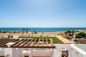 a view of the beach from the balcony of a building at MarLau Breeze in Mojácar +39 photos