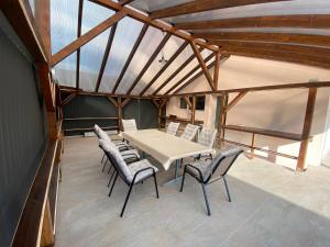 a dining room with a table and chairs at Garden Spa Resort in Budapest