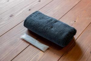 a sock sitting on top of a wooden floor at Kussharoko Artemina Deer in Teshikaga +18 photos