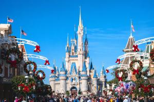 a crowd of people standing in front of cinderella castle at Road Stop Studio - Paris - Disney- Train Station in Chelles +2 photos