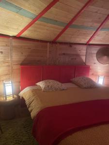 a bedroom with a large bed with two lamps at B&B L'Albatros in Fayence +8 photos