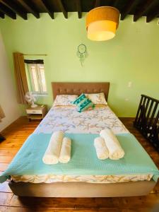 a bedroom with a bed with two pillows on it at Plativola Mountain View in Sitia