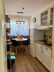 a kitchen with a table and a dining room at ThePAGHouse in Pag