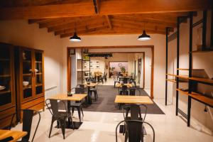a restaurant with tables and chairs in a room at HYN Hotel Boutique in General Belgrano
