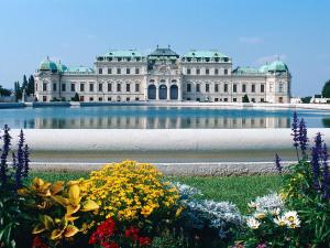 a large white building with flowers in front of it at Ibis budget Wien Sankt Marx in Vienna