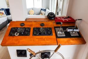 a kitchen counter with a stove and a sink at Endless Summer Oceanside Views in Boston