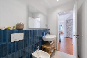 a bathroom with a sink and a mirror at Casa alta lucio in Bonassola +22 photos