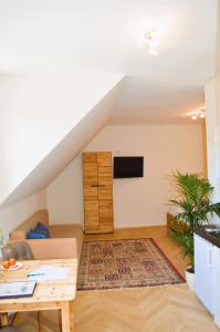 a living room with a couch and a table at Weingut Primus Südsteiermark in Spielfeld