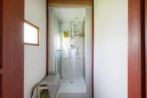 a bathroom with a shower and a toilet in it at ゲストハウス五郎平 in Nagahama +28 photos