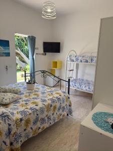 a bedroom with a bed and two bunk beds at B&B Sunset da carla in Agropoli +100 photos