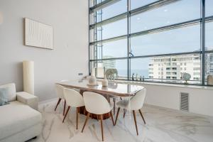 a dining room with a table and chairs at Penthouse Duplex with TOP Views! in Barcelona