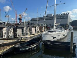 two boats are docked at a dock in the water at La Mare Resort in Gothenburg
