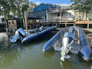 a couple of inflatable boats in the water at La Mare Resort in Gothenburg