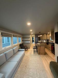 a living room with a couch and a kitchen at The Wave in Boston