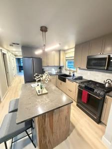 a kitchen with a island in the middle of it at The Wave in Boston