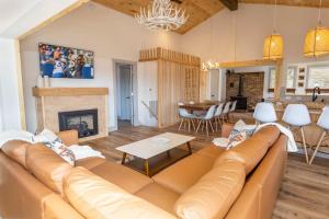 a living room with a couch and a fireplace at A Red Chalet in Newland
